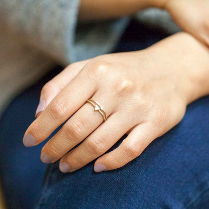 Girl wearing love and loss ring pair hand-molded and cast in 10k yellow gold with genuine stones or conflict free genuine diamonds 