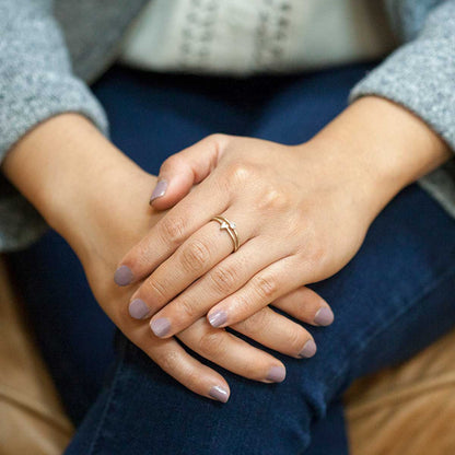 Girl wearing love and loss ring pair hand-molded and cast in 14k yellow gold with genuine stones or conflict free genuine diamonds 