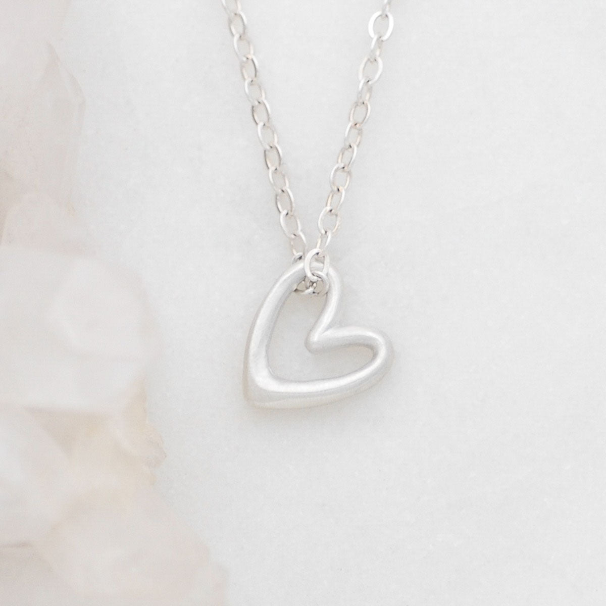 Love Grows necklace handcrafted in sterling silver with the heart charm strung on sterling silver chain