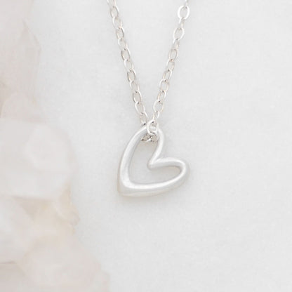 Love Grows necklace handcrafted in sterling silver with the heart charm strung on sterling silver chain