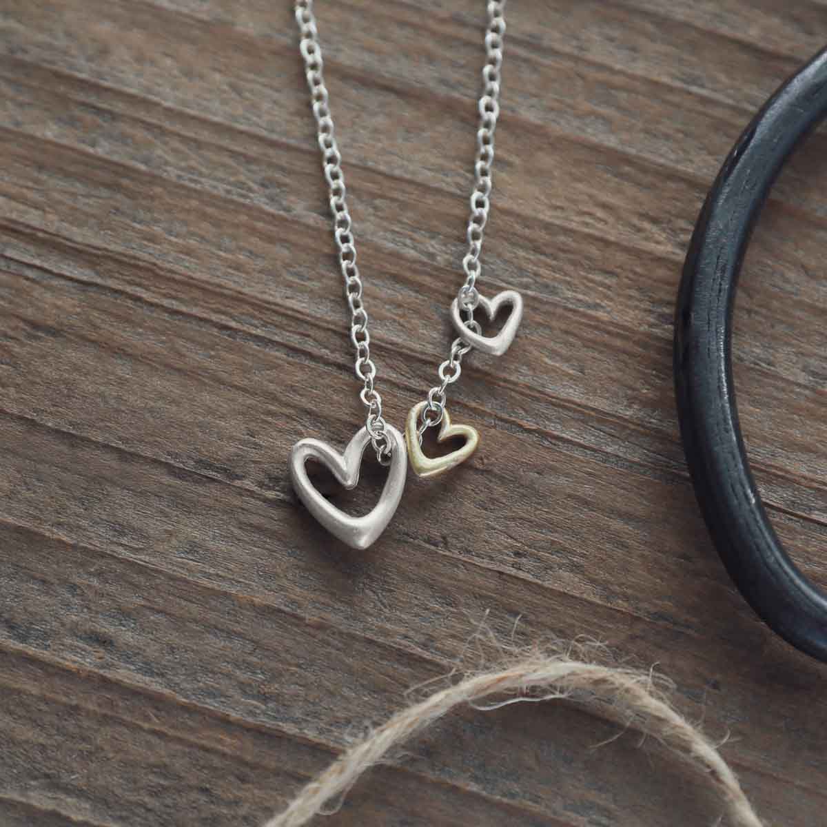 Love Grows necklace handcrafted in sterling silver with the heart charm sterling silver or 10k gold