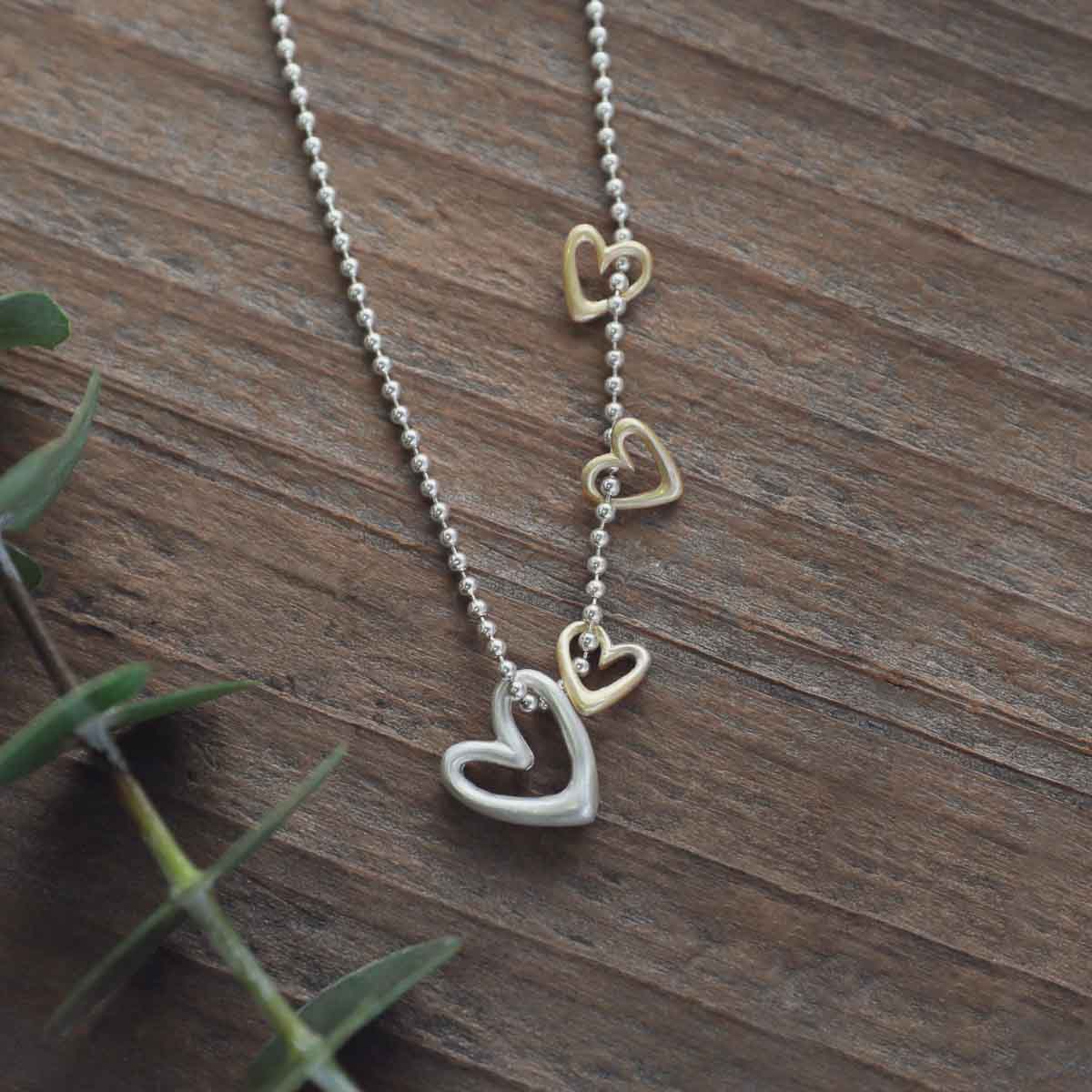 Love Grows necklace handcrafted in sterling silver with the heart charm sterling silver or 10k gold