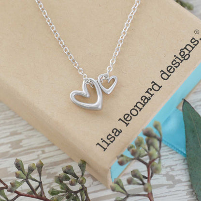 Love Grows necklace handcrafted in sterling silver with the heart charm strung on sterling silver chain