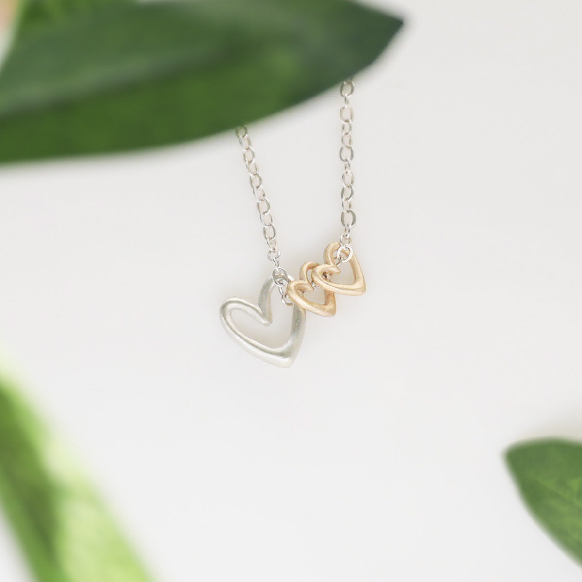 Love Grows necklace handcrafted in sterling silver with the heart charm sterling silver or 10k gold