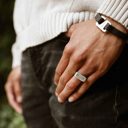 man wearing an antiqued sterling silver Make Your Mark Signet ring