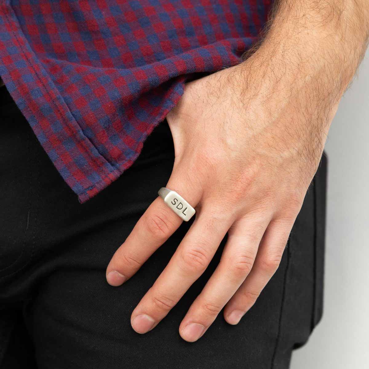 man wearing a sterling silver Make Your Mark Signet ring