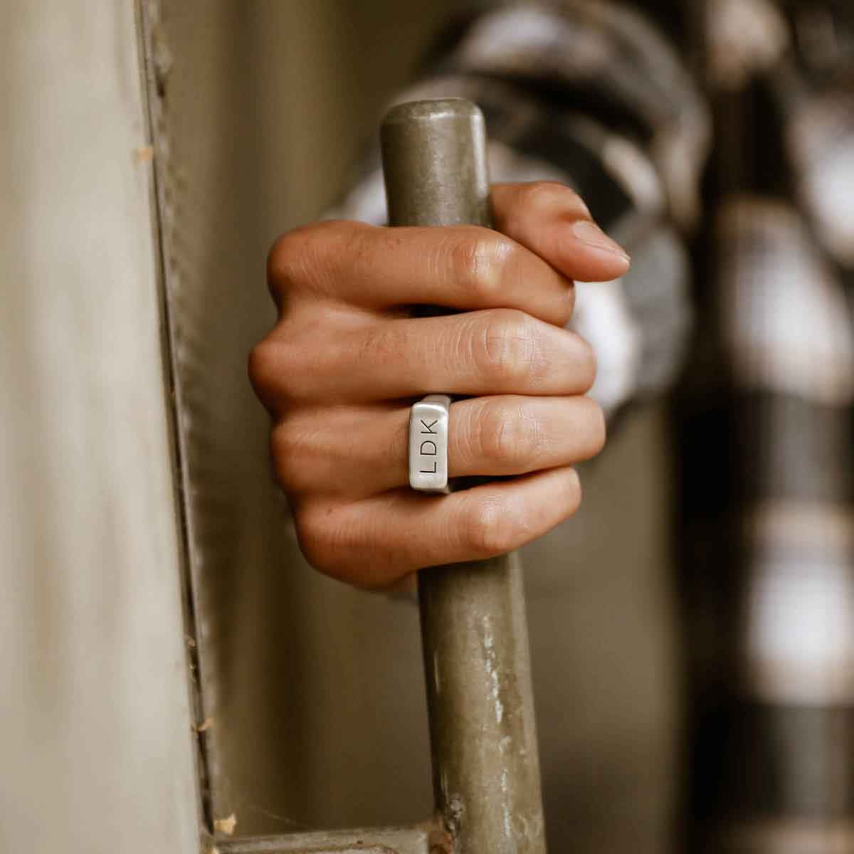 man wearing a sterling silver Make Your Mark Signet ring