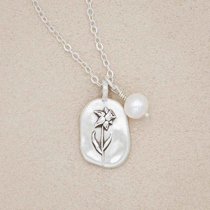 March birth flower necklace handcrafted in sterling silver with a special birth month charm strung with a vintage freshwater pearl