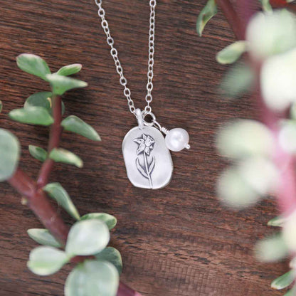 March birth flower necklace handcrafted in sterling silver with a special birth month charm strung with a vintage freshwater pearl