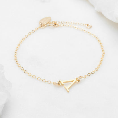 14k yellow gold monogram bracelet with a satin finish 