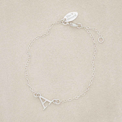 Sterling silver monogram bracelet with a satin finish