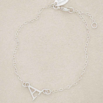 Sterling silver monogram bracelet with a satin finish 