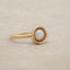 Nesting freshwater large pearl ring hand cast in 10k yellow gold holding inside a large 6mm freshwater pearl