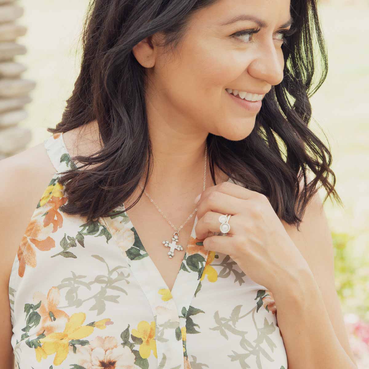 Girl wearing Nesting freshwater large pearl ring hand cast in sterling silver holding inside a large 6mm freshwater pearl 