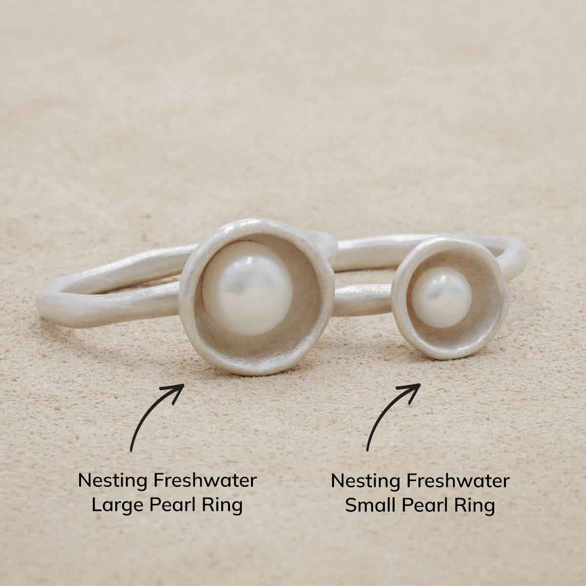 Nesting freshwater large pearl ring hand cast in sterling silver holding inside a large 6mm freshwater pearl 