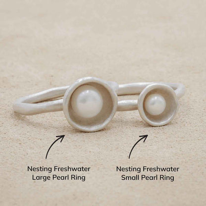 Nesting freshwater large pearl ring hand cast in sterling silver holding inside a large 6mm freshwater pearl 