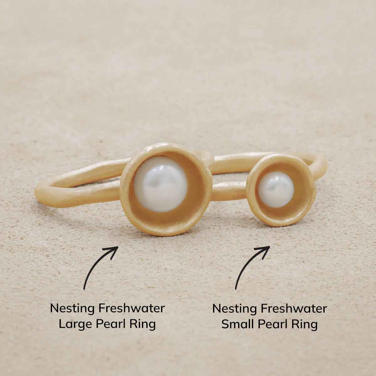 Nesting freshwater large pearl ring hand cast in 10k yellow gold holding inside a large 6mm freshwater pearl 