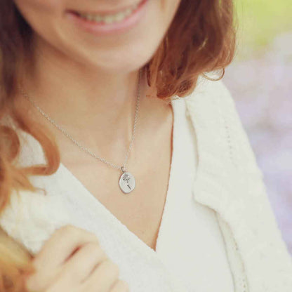 girl wearing a sterling silver November birth flower necklace