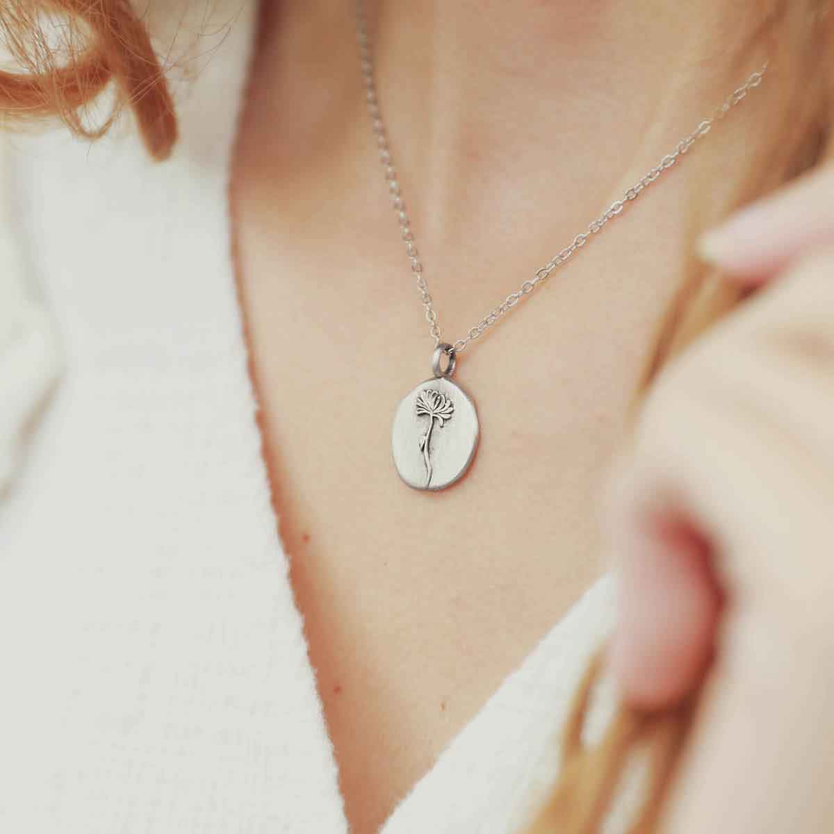 girl wearing a sterling silver November birth flower necklace