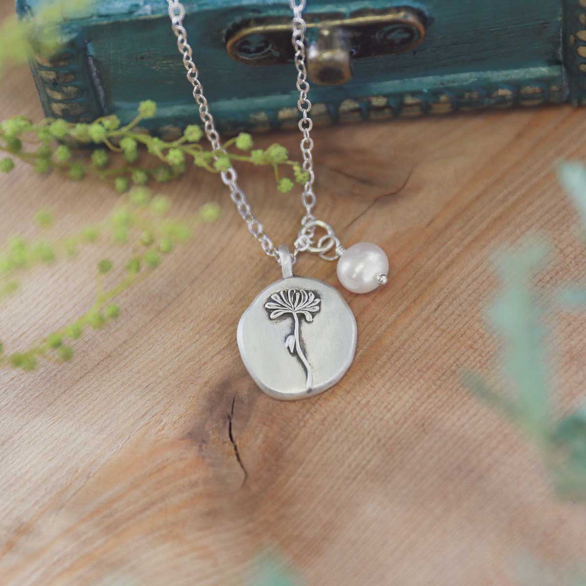 November birth flower necklace handcrafted in sterling silver with a special birth month charm strung with a vintage freshwater pearl