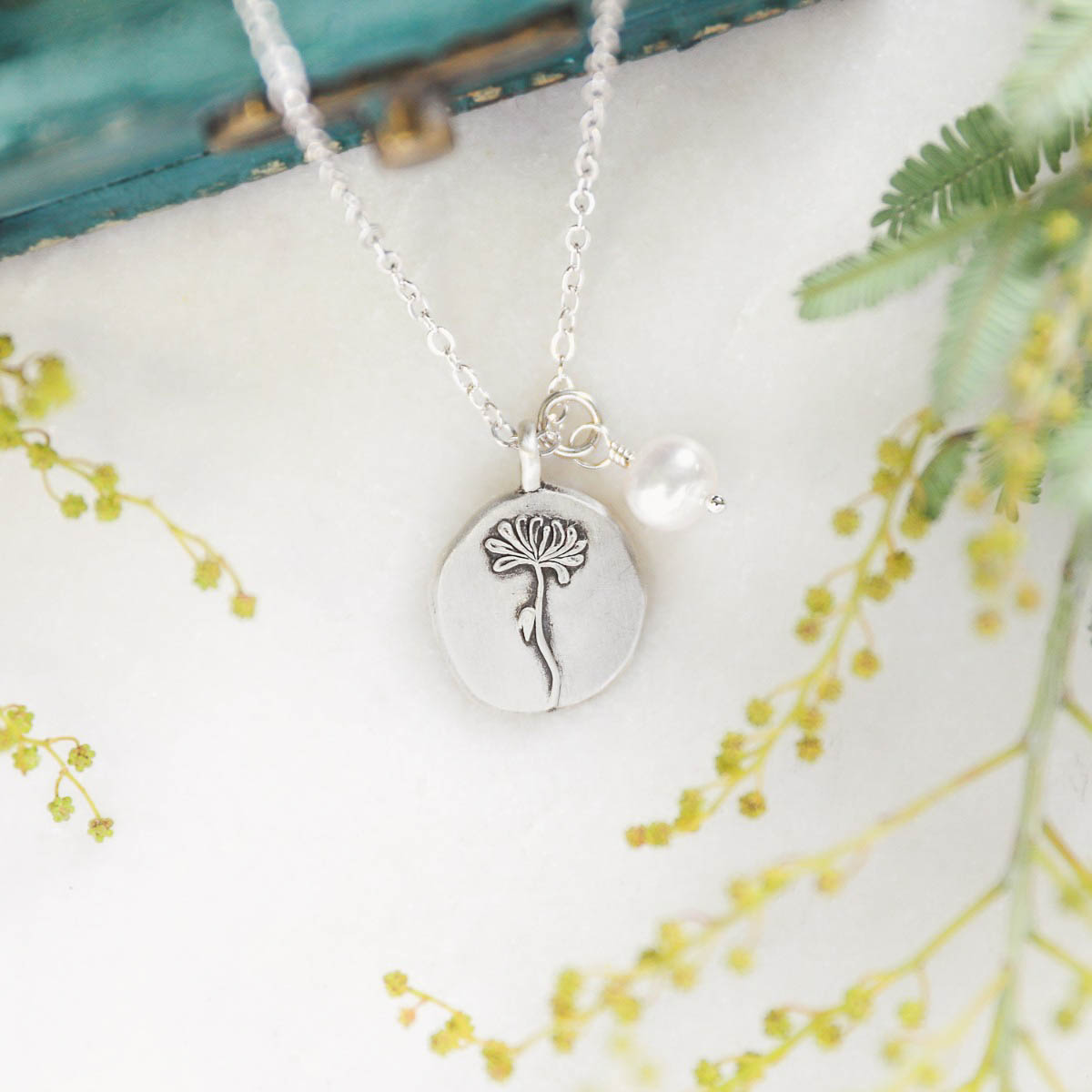 November birth flower necklace handcrafted in sterling silver with a special birth month charm strung with a vintage freshwater pearl