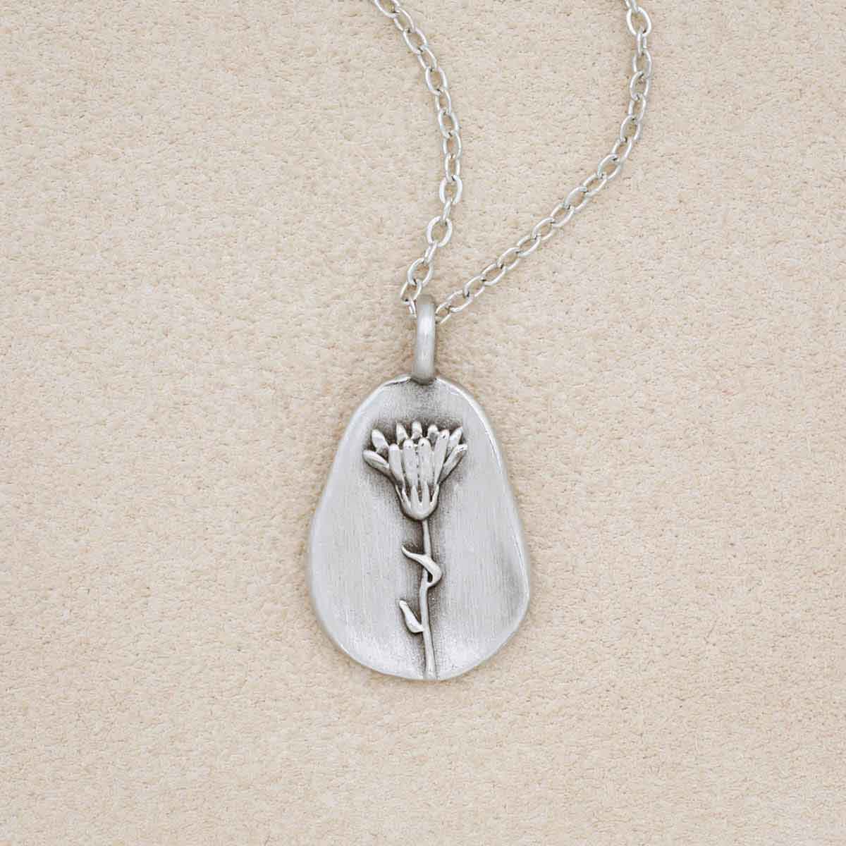 pewter October Birth Flower necklace with 18" link chain, on beige background