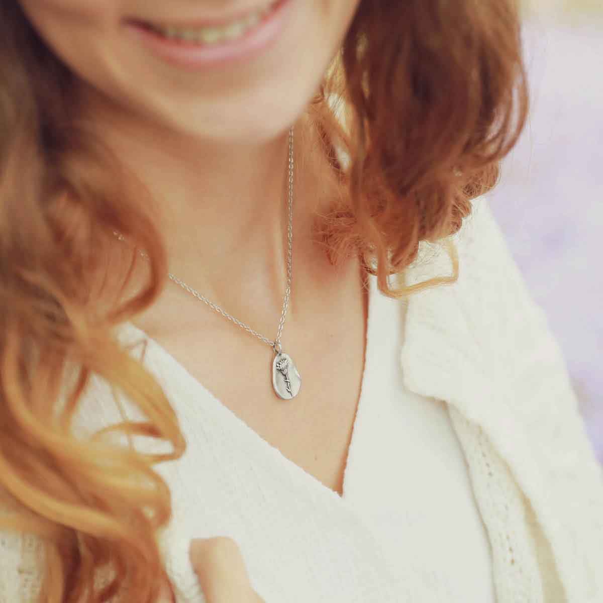 sterling silver October birth flower necklace on slate background