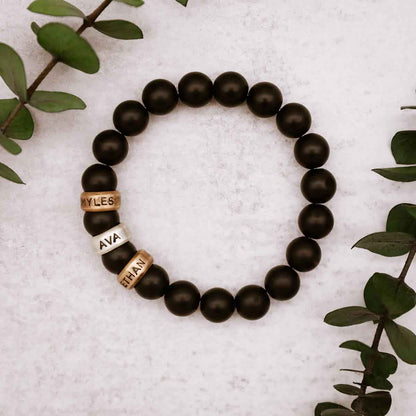 Man holding a Black Onyx Beaded Name Bracelet