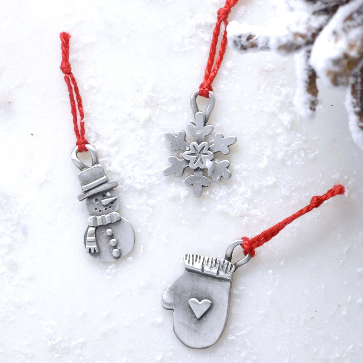 our Christmas tradition advent ornament set handcrafted and cast in fine pewter and includes all 24 ornaments in individual numbered bags