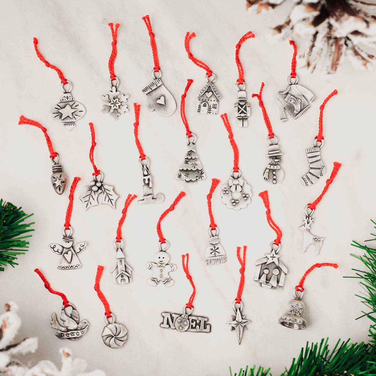 our Christmas tradition advent ornament set handcrafted and cast in fine pewter and includes all 24 ornaments in individual numbered bags