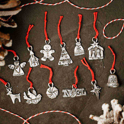 our Christmas tradition advent ornament set handcrafted and cast in fine pewter and includes all 24 ornaments in individual numbered bags