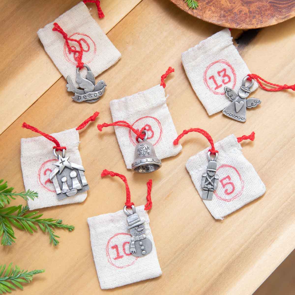 our Christmas tradition advent ornament set handcrafted and cast in fine pewter and includes all 24 ornaments in individual numbered bags