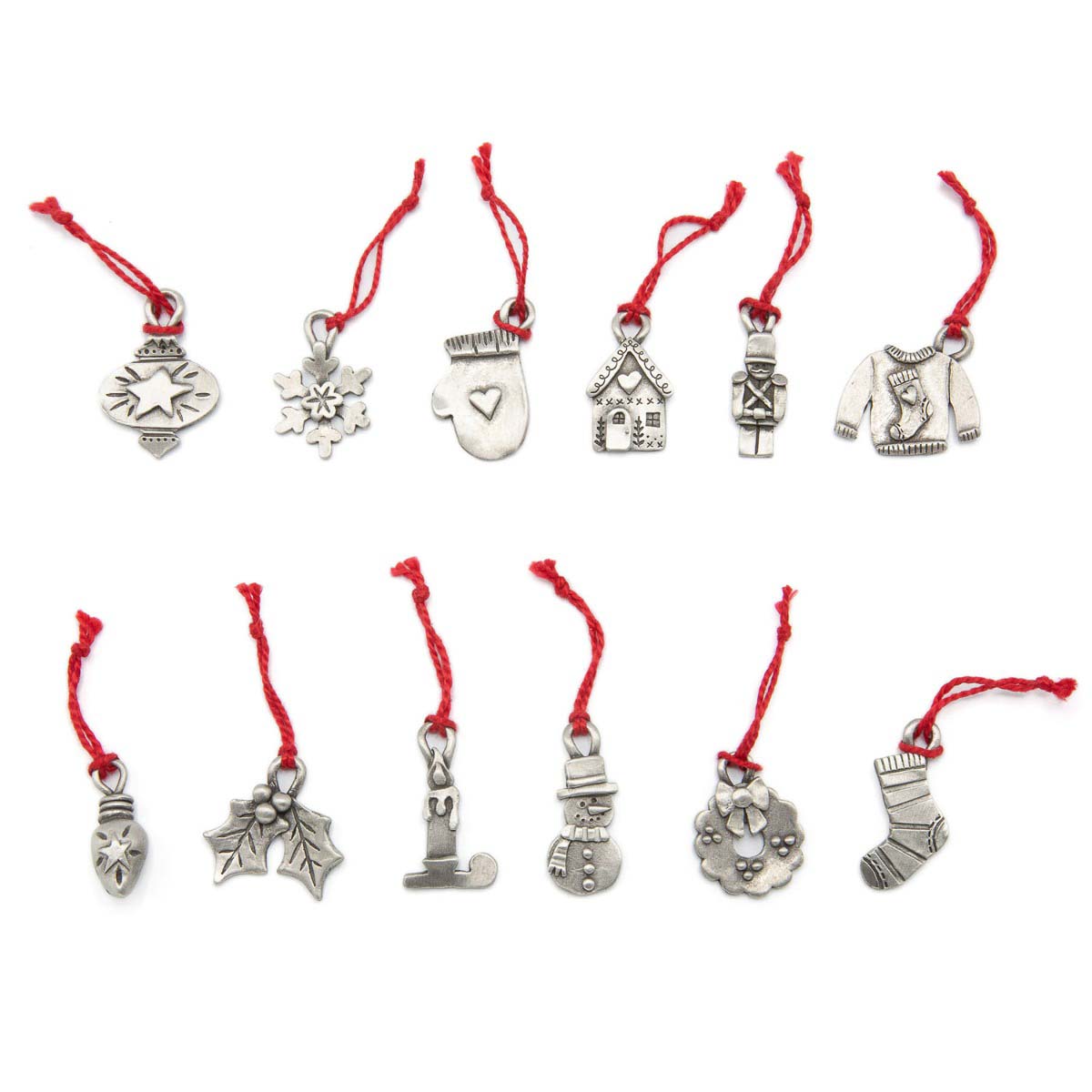 our Christmas tradition advent ornament set handcrafted and cast in fine pewter and includes all 24 ornaments in individual numbered bags