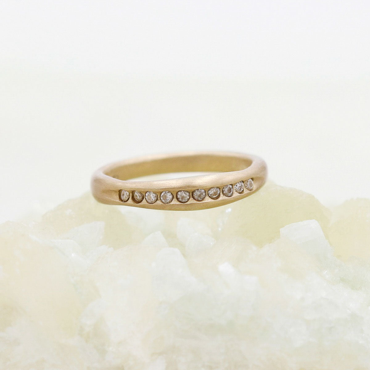 Passage ring handcrafted in 10k yellow gold and display of 1.5mm cubic zirconias 