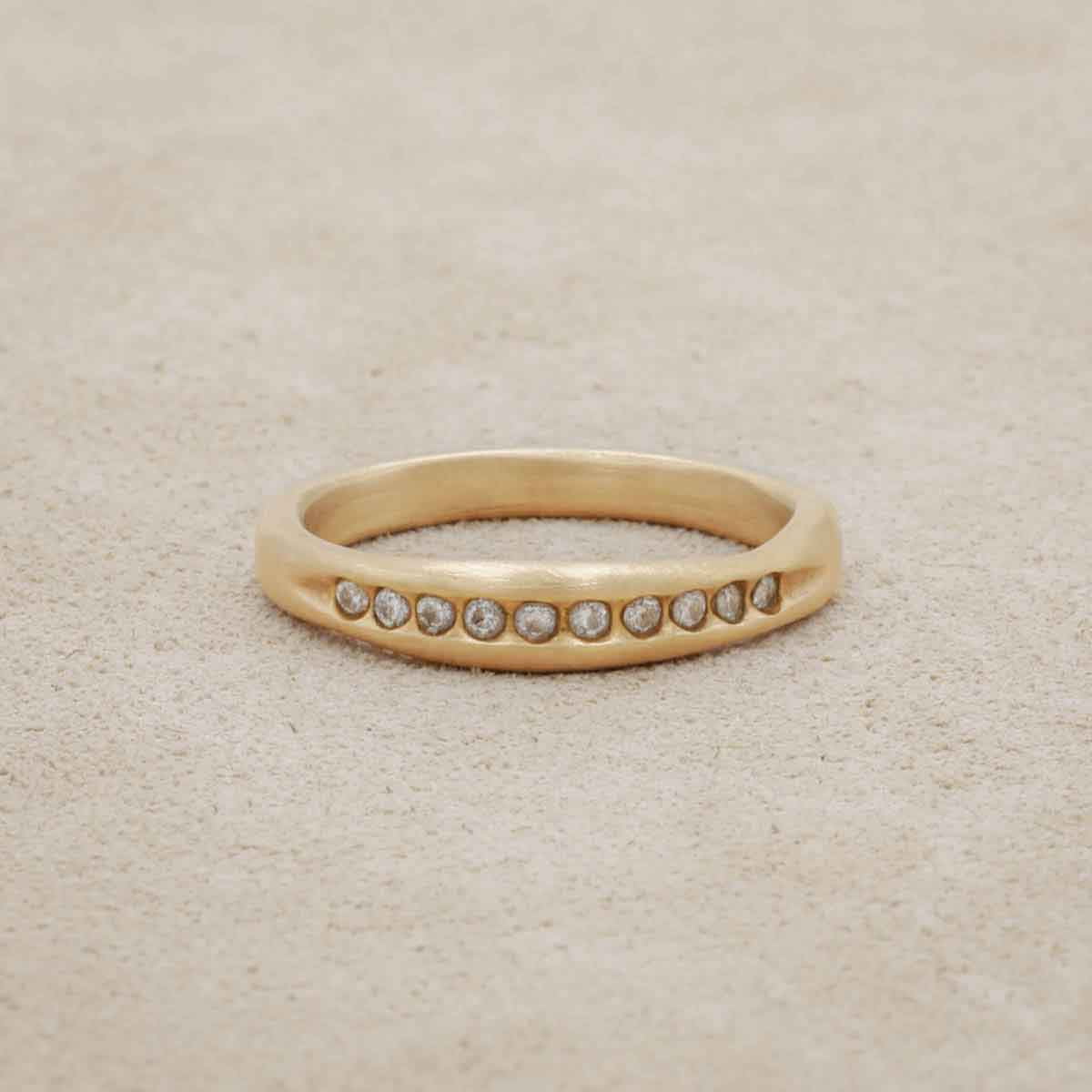 Passage ring handcrafted in 10k yellow gold and display of 1.5mm cubic zirconias