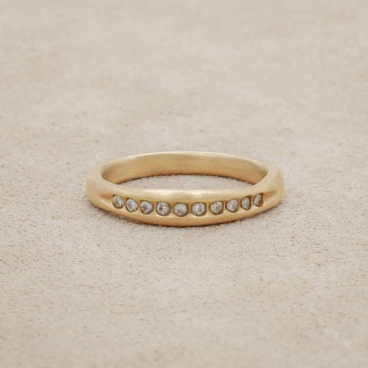 Passage ring handcrafted in 14k yellow gold and display of 1.5mm cubic zirconias