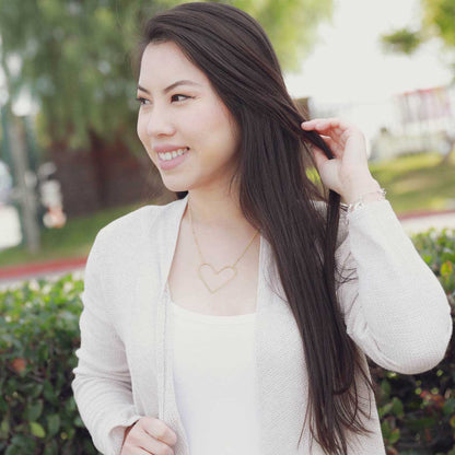 girl wearing a gold filled Peaceful Heart Necklace