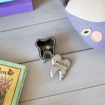 a Personalized tooth fairy box handcrafted in pewter and hand stamped with a name on it