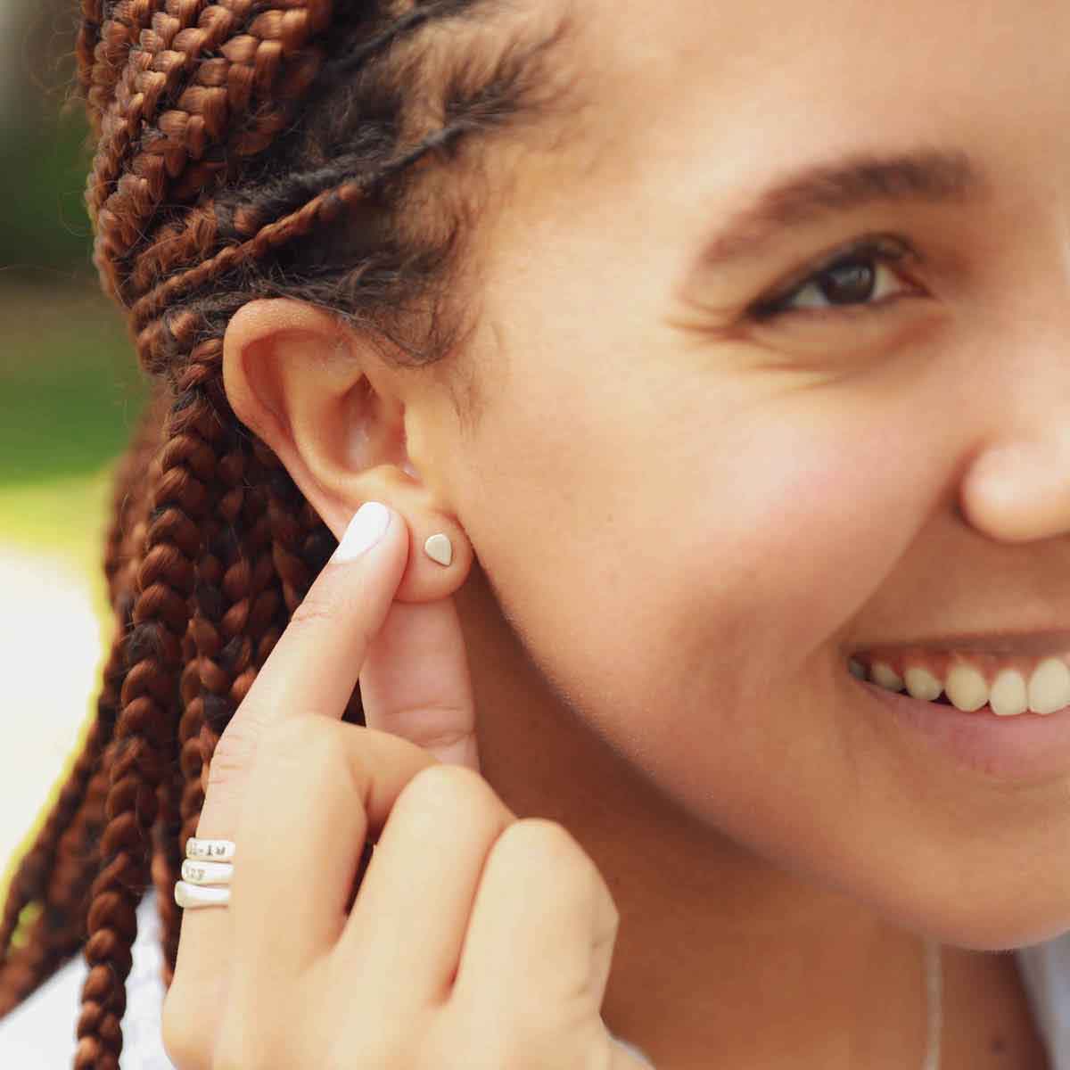 girl wearing sterling silver raindrop stud earrings