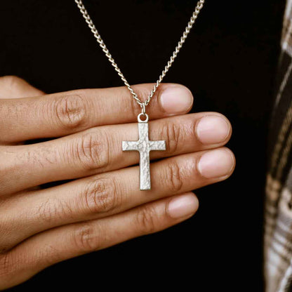 man wearing a pewter Redemption Cross Necklace