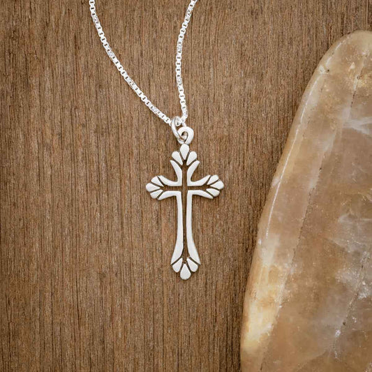 sterling silver Resurrection Cross Necklace, on wood background