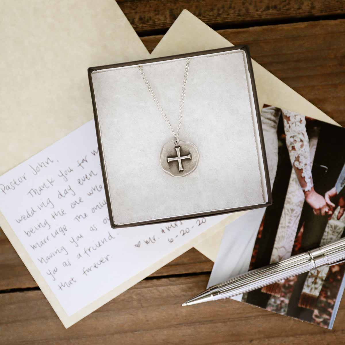 Roman Cross Coin necklace handcrafted in sterling silver strung on sterling silver curb chain in original packaging