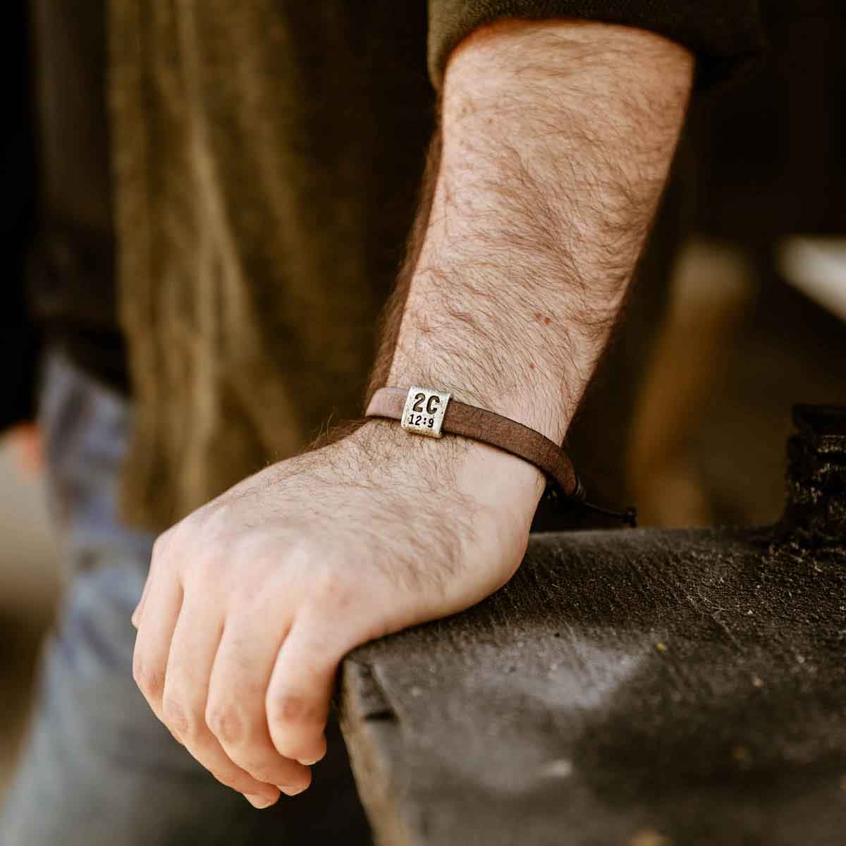 man wearing a brown Equitable Leather Verse Bracelet 