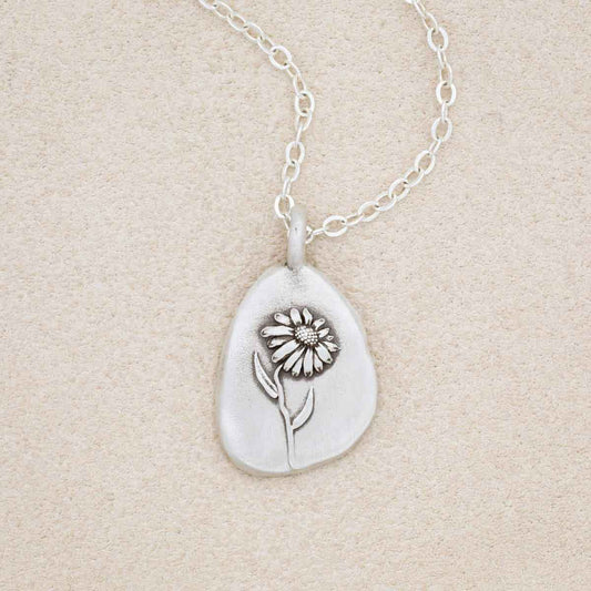 sterling silver September birth flower necklace, on beige background