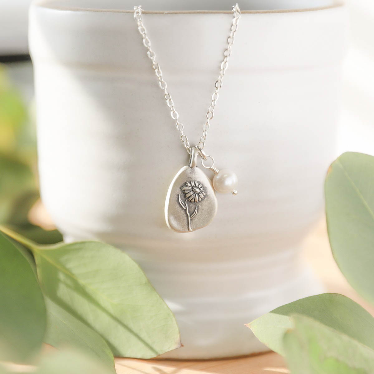 September birth flower necklace handcrafted in sterling silver with a special birth month charm strung with a vintage freshwater pearl