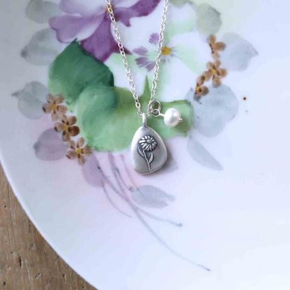 September birth flower necklace handcrafted in sterling silver with a special birth month charm strung with a vintage freshwater pearl