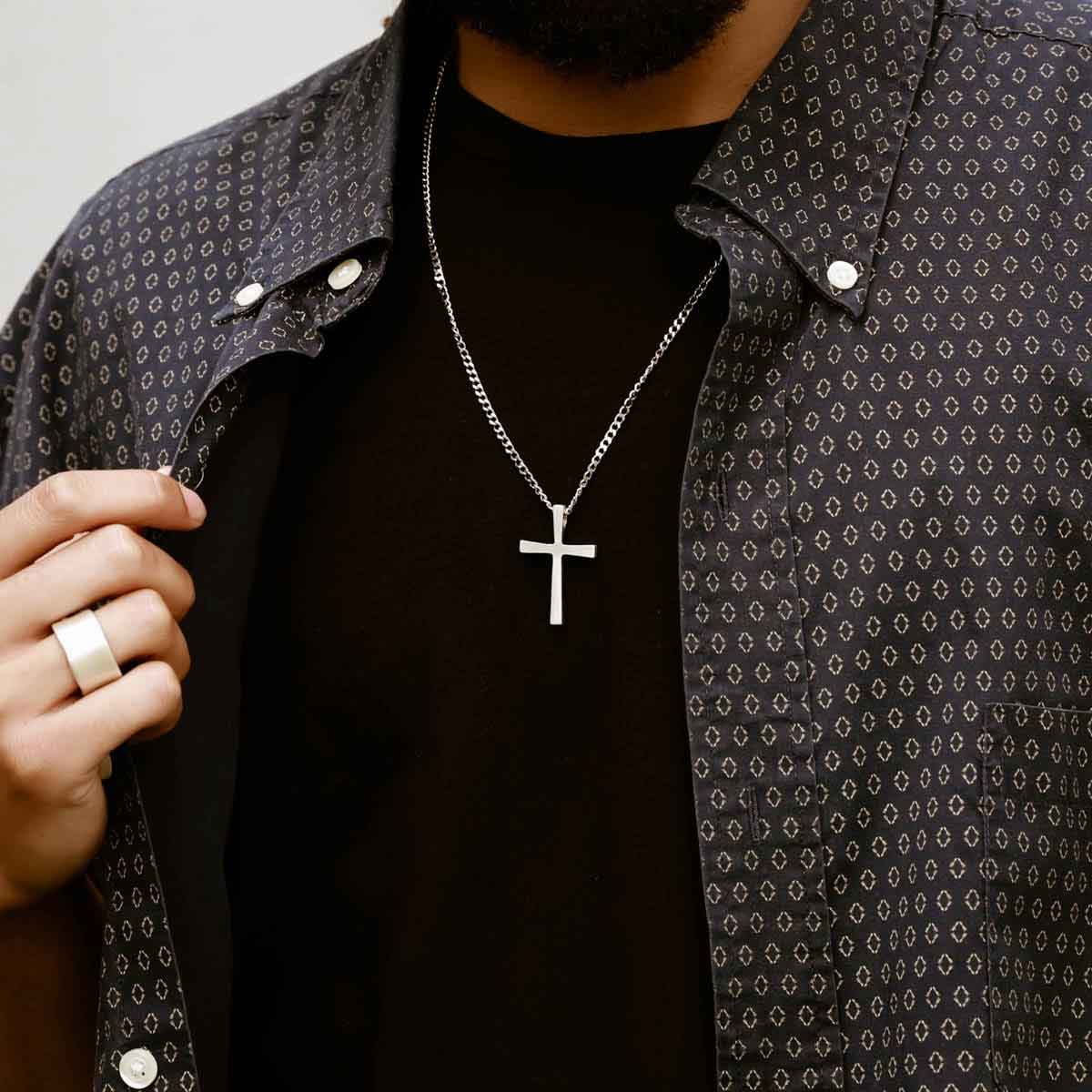 man wearing a pewter Set Free Cross Necklace