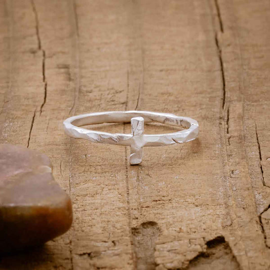 sterling silver Simple Hammered Cross Ring, on wood background