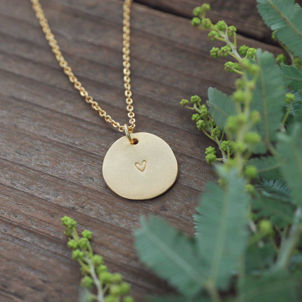 small and mighty heart disc necklace gold plated