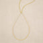 Sorrow and Joy Teardrop Necklace handcrafted in gold filled, on suede background 
